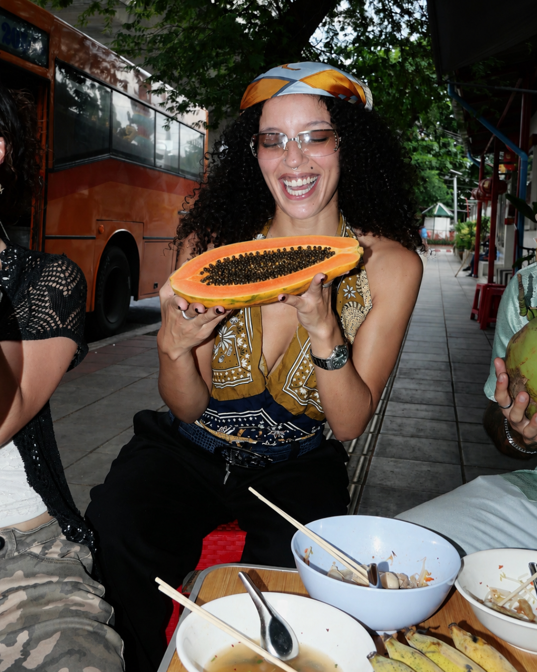 Campaign talent holding a sliced papaya